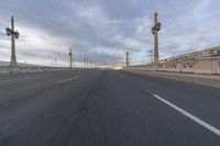 a large highway filled with lots of tall metal towers and wires on either side of it