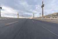 a large highway filled with lots of tall metal towers and wires on either side of it