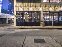 a bus stop with a blue cross walk sign and the exit sign for an underground subway station