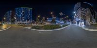 this is a fish eye lens that displays a view of a city intersection at night