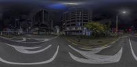 a 360 - angle lens shows traffic passing through a city intersection and buildings as well as dark clouds