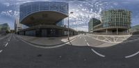 a fisheye view of a street and buildings through the lens of a fish eye lens