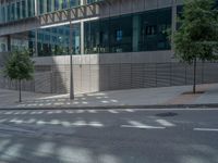 an empty street with an empty stop sign at the intersection of two streets is pictured