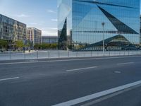 this is a photo of a deserted street with buildings and a lot of vehicles on the road