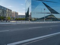 this is a photo of a deserted street with buildings and a lot of vehicles on the road