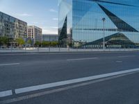 this is a photo of a deserted street with buildings and a lot of vehicles on the road