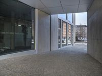 an entrance to a building with the word time to decide the future written on glass