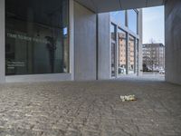 an entrance to a building with the word time to decide the future written on glass