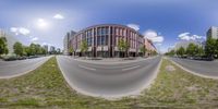 an 360 - view image of several streets and buildings taken with a fisheye lens