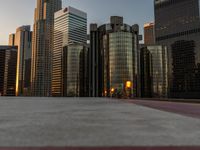 a cityscape is in the sunset light with tall buildings in the background with blue sky