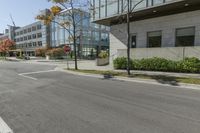 a traffic light on a road in front of buildings and trees in the background that have just been changed