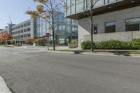 a traffic light on a road in front of buildings and trees in the background that have just been changed