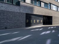 a sign that reads pieros on the side of a building in a city area