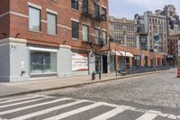 a crosswalk on the side of a road next to a street light and buildings