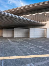 the white walls of the building are clad with wood panels and studdings that make it look like a wall