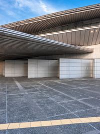 the white walls of the building are clad with wood panels and studdings that make it look like a wall