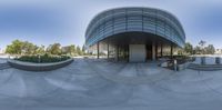 a view from the front of an empty building towards a courtyard and parking lot on either side