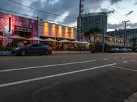 this is the view of a small restaurant from a street corner outside it's called the cafe