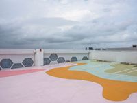 a colorful skate park area in the sky with clouds above it to provide an interesting environment