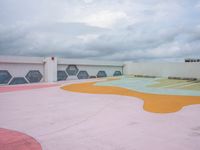 a colorful skate park area in the sky with clouds above it to provide an interesting environment