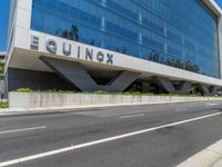 a woman walks past the equinx headquarters in atlanta, ga, on thursday, may 23, 2017