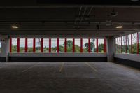 a large parking garage is shown with red and white stripes on the windows on the wall