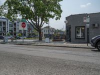 a store on the corner in a small town that has lots of gray brick walls