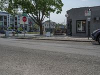 a store on the corner in a small town that has lots of gray brick walls