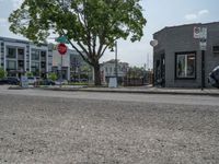 a store on the corner in a small town that has lots of gray brick walls