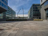 empty square with buildings in the background under blue skies and a sky with clouds above