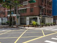 a crosswalk in a big city street that is not going much right into the city