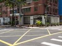 a crosswalk in a big city street that is not going much right into the city