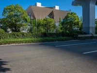 the city of richmond has long white arrows running down it's side and a pedestrian crossing over an expressway