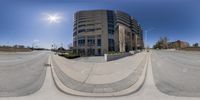 a street with some building in it as viewed through the fish eye lens using a fisheye lens