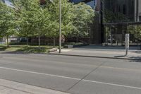 a picture of a city street with parked cars on it and a building across the road