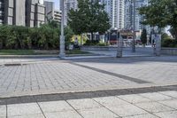 a person sitting at the bench in front of a mall that is empty of people