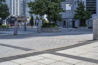 a person sitting at the bench in front of a mall that is empty of people