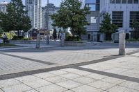 a person sitting at the bench in front of a mall that is empty of people