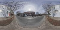 three different shots are shown of a circular view of the intersection of an empty street and cars