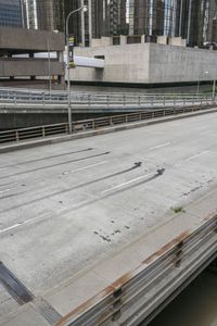 an empty street under an overpass near buildings in the city of pittsburgh, pennsylvania