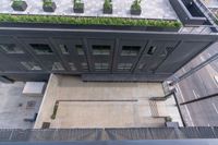 aerial shot of a green roof on a building with plants growing on the top of it