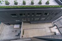 aerial shot of a green roof on a building with plants growing on the top of it