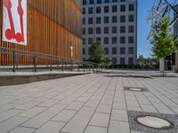 a group of people riding skateboards near wooden panels and stairss with artwork on them