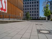 a group of people riding skateboards near wooden panels and stairss with artwork on them