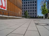 a group of people riding skateboards near wooden panels and stairss with artwork on them