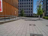 a group of people riding skateboards near wooden panels and stairss with artwork on them