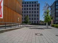 a group of people riding skateboards near wooden panels and stairss with artwork on them