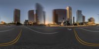 a view of the city from an intersection in this time lapse camera lens image