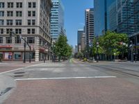 an intersection with buildings on both sides and a street light in the middle of the road