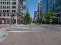 an intersection with buildings on both sides and a street light in the middle of the road